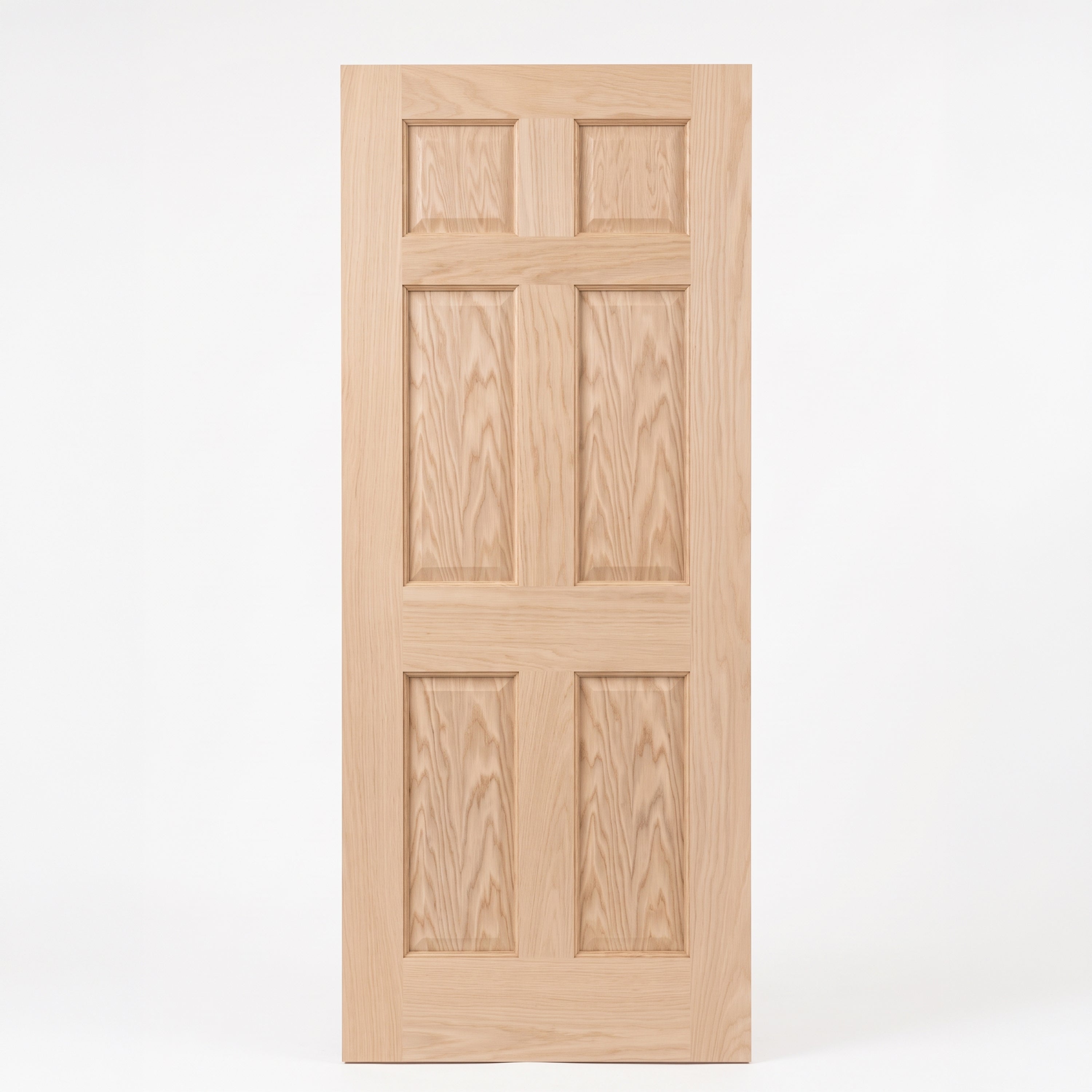 Unfinished oak 6 panel interior door, two small raised panels across the top and two tall raised panels in the middle and at the bottom.