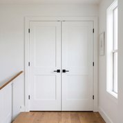 Pair of matching 2 Panel Flat double doors on an upstairs hallway linen closet
